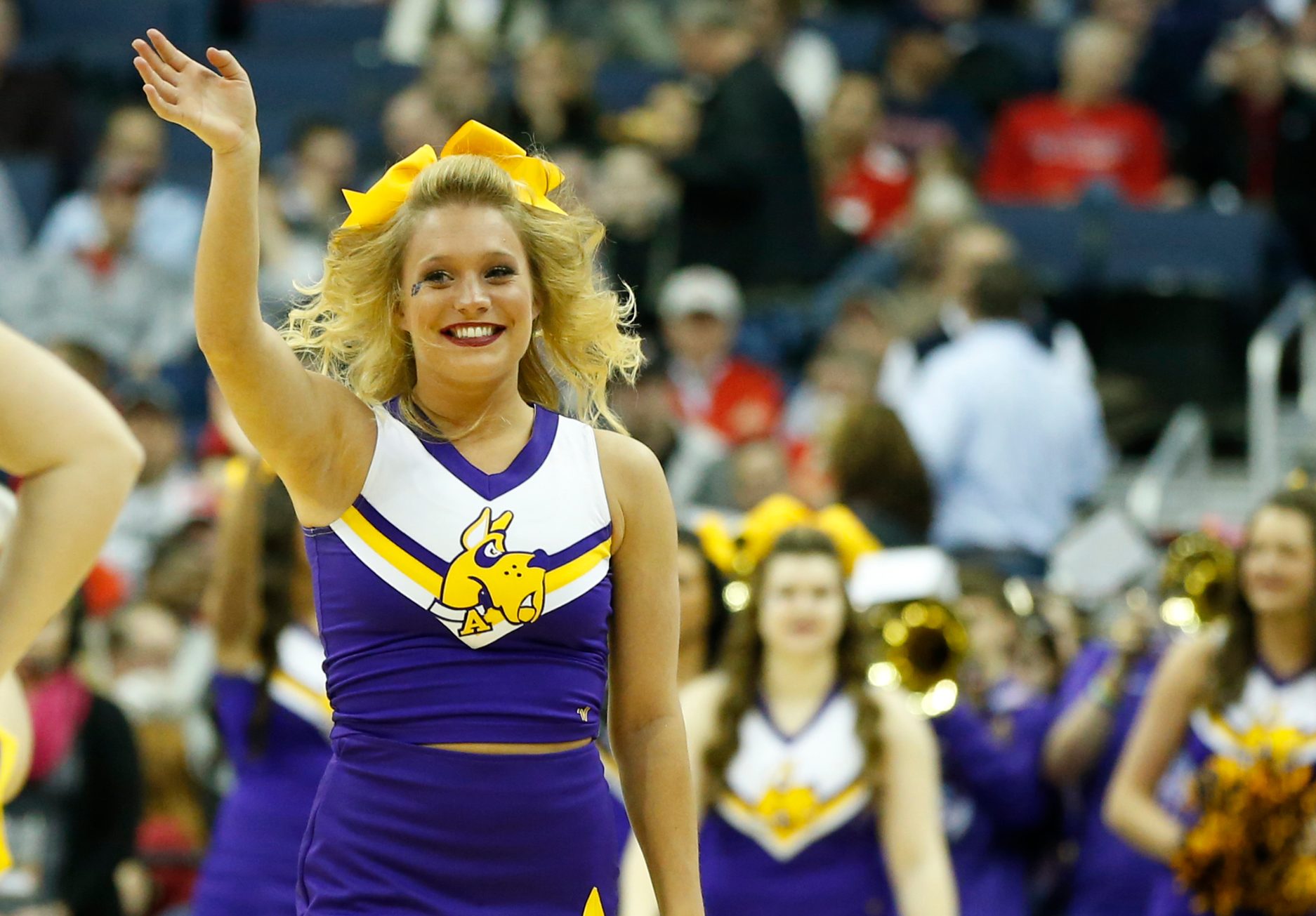 Mar 20, 2015; Columbus, OH, USA; Albany Great Danes cheerleader waves during the second half against the Oklahoma Sooners in the second round of the 2015 NCAA Tournament at Nationwide Arena. Mandatory Credit: Greg Bartram-Imagn Images