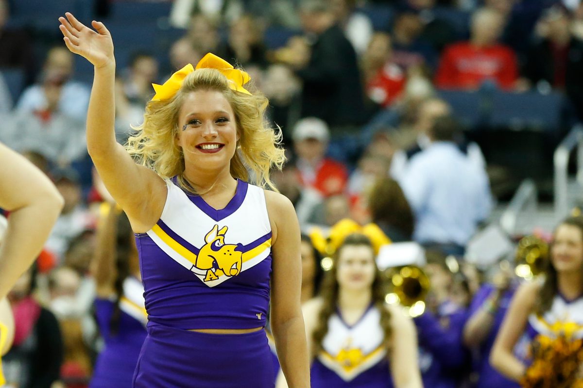 Mar 20, 2015; Columbus, OH, USA; Albany Great Danes cheerleader waves during the second half against the Oklahoma Sooners in the second round of the 2015 NCAA Tournament at Nationwide Arena. Mandatory Credit: Greg Bartram-Imagn Images