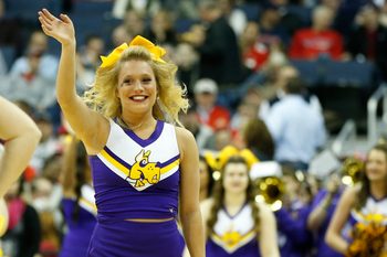 Mar 20, 2015; Columbus, OH, USA; Albany Great Danes cheerleader waves during the second half against the Oklahoma Sooners in the second round of the 2015 NCAA Tournament at Nationwide Arena. Mandatory Credit: Greg Bartram-Imagn Images