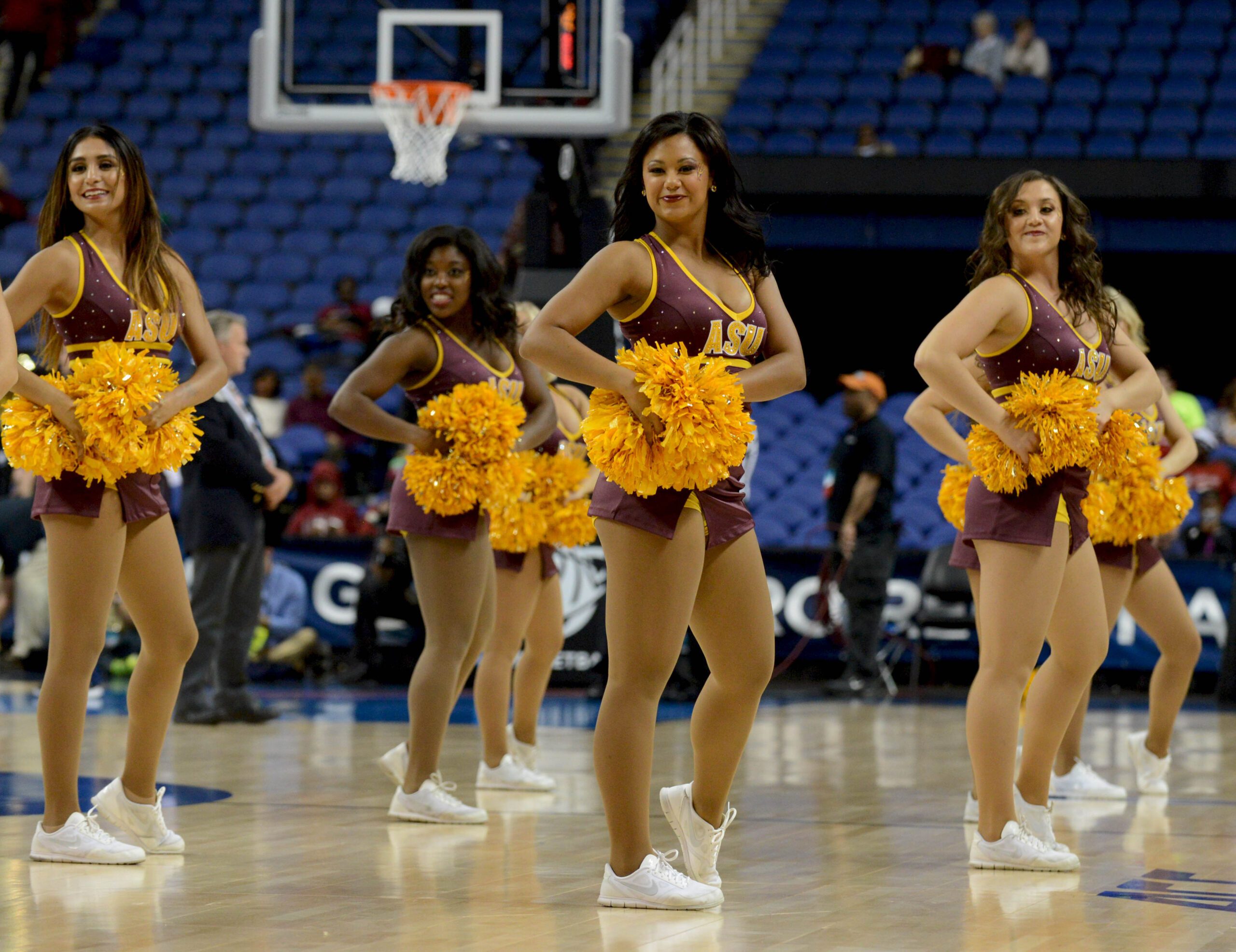Mar 27, 2015; Greensboro, NC, USA; Arizona State Sun Devils cheerleaders perform during the first half against the Florida State Seminoles in the semifinals of the Greensboro regional in the women's 2015 NCAA Tournament at Greenboro Coliseum Complex. Mandatory Credit: Rob Kinnan-Imagn Images