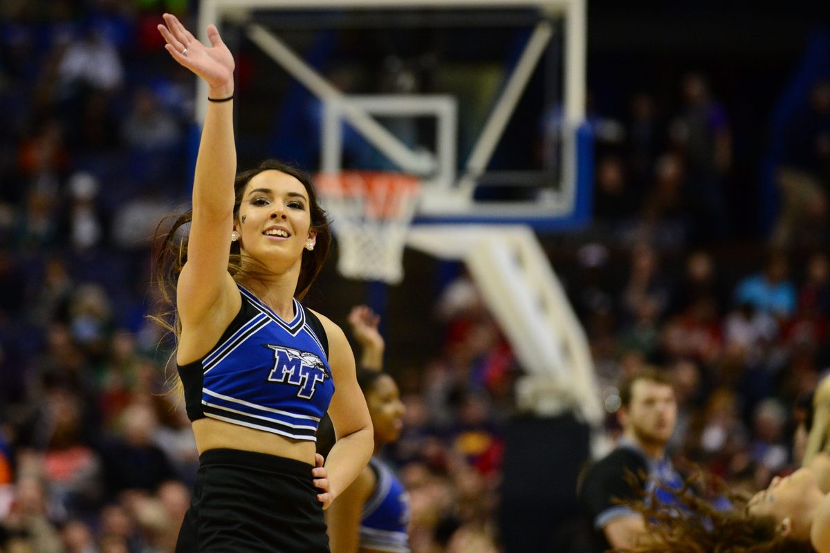 Mar 18, 2016; St. Louis, MO, USA; Middle Tennessee Blue Raiders cheerleaders waves during the first half of the first round against the Michigan State Spartans in the 2016 NCAA Tournament at Scottrade Center. Mandatory Credit: Jeff Curry-Imagn Images
