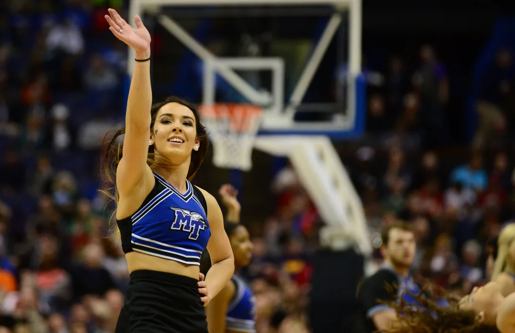 Mar 18, 2016; St. Louis, MO, USA; Middle Tennessee Blue Raiders cheerleaders waves during the first half of the first round against the Michigan State Spartans in the 2016 NCAA Tournament at Scottrade Center. Mandatory Credit: Jeff Curry-Imagn Images
