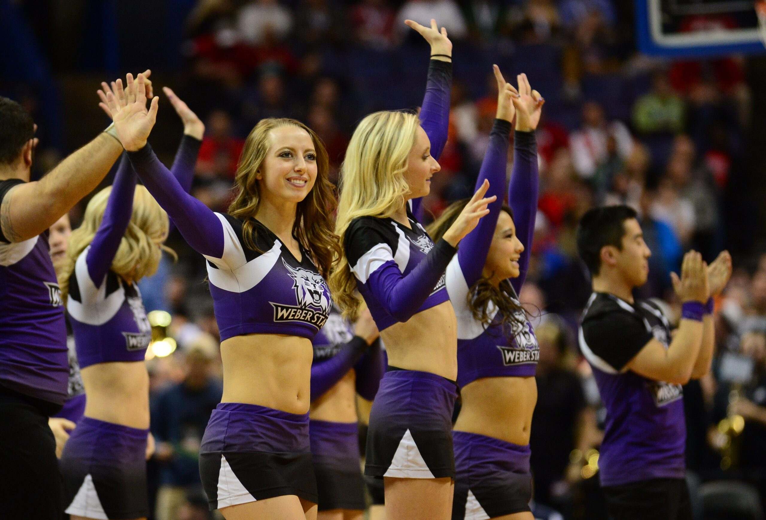 Mar 18, 2016; St. Louis, MO, USA; Weber State Wildcats cheerleaders wave during the first half of the game in the first round against the Xavier Musketeers in the 2016 NCAA Tournament at Scottrade Center. Mandatory Credit: Jeff Curry-Imagn Images