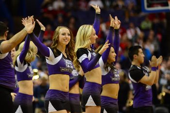 Mar 18, 2016; St. Louis, MO, USA; Weber State Wildcats cheerleaders wave during the first half of the game in the first round against the Xavier Musketeers in the 2016 NCAA Tournament at Scottrade Center. Mandatory Credit: Jeff Curry-Imagn Images