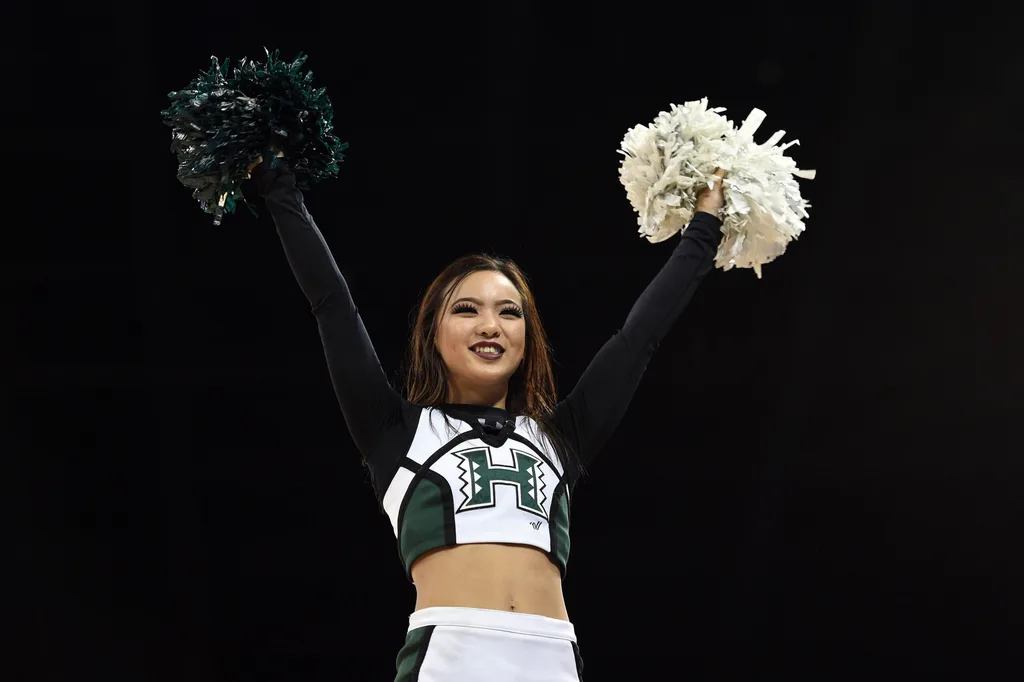 March 20, 2016; Spokane , WA, USA; Hawaii Rainbow Warriors cheerleader performs during the second half in the second round of the 2016 NCAA Tournament at Spokane Veterans Memorial Arena. Mandatory Credit: Kyle Terada-Imagn Images