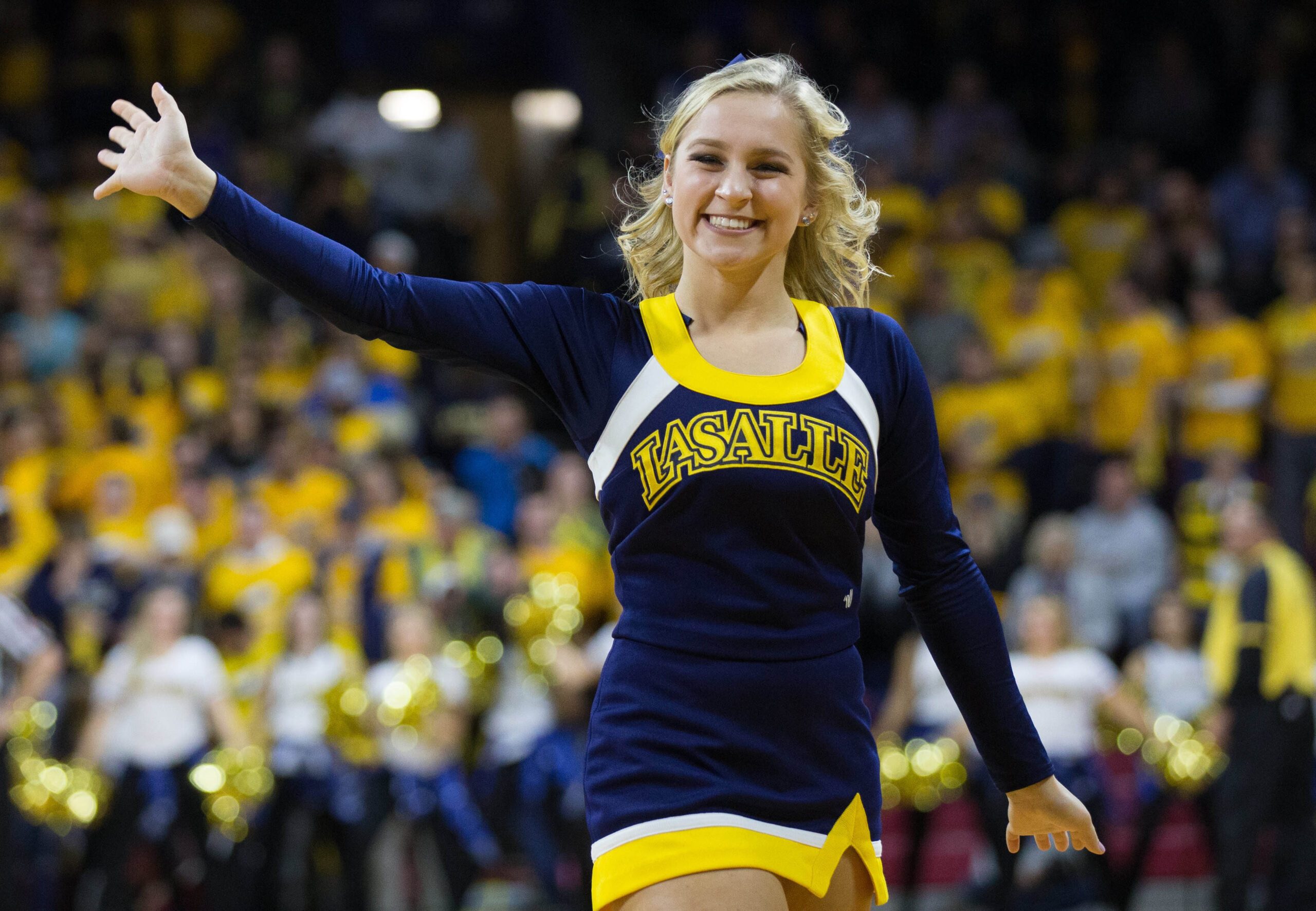 Dec 6, 2016; Philadelphia, PA, USA; A La Salle Explorers cheerleader waves to fans during the second half against the Villanova Wildcats at Palestra. The Villanova Wildcats won 89-79. Mandatory Credit: Bill Streicher-Imagn Images