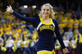 Dec 6, 2016; Philadelphia, PA, USA; A La Salle Explorers cheerleader waves to fans during the second half against the Villanova Wildcats at Palestra. The Villanova Wildcats won 89-79. Mandatory Credit: Bill Streicher-Imagn Images