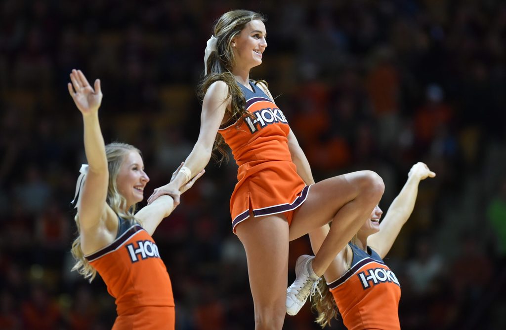Jan 18, 2017; Blacksburg, VA, USA; Members of the Virginia Tech Hokies cheerleading squad perform during the game against the Georgia Tech Yellow Jackets at Cassell Coliseum. Mandatory Credit: Michael Shroyer-Imagn Images