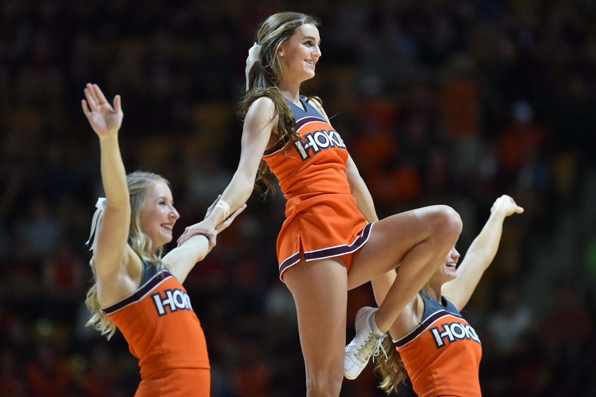 Jan 18, 2017; Blacksburg, VA, USA; Members of the Virginia Tech Hokies cheerleading squad perform during the game against the Georgia Tech Yellow Jackets at Cassell Coliseum. Mandatory Credit: Michael Shroyer-Imagn Images