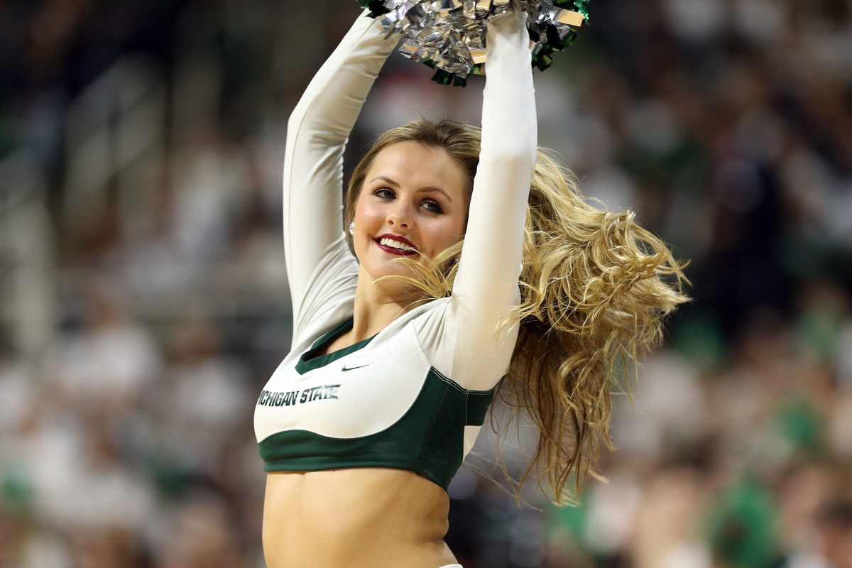 Jan 29, 2017; East Lansing, MI, USA; Michigan State Spartans cheerleader performs during the first half of a game between the Michigan State Spartans and the Michigan Wolverines at the Jack Breslin Student Events Center. Mandatory Credit: Mike Carter-Imagn Images
