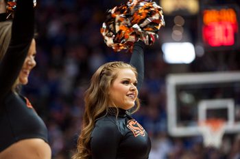 Mar 8, 2018; Kansas City, MO, United States; A Oklahoma State Cowboys cheerleader smiles in the first half against the Kansas Jayhawks during the semifinals of the Big 12 Tournament at Sprint Center. Mandatory Credit: Amy Kontras-Imagn Images