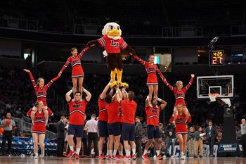 Mar 24, 2019; San Jose, CA, USA; Liberty Flames cheerleaders and mascot performs against the Virginia Tech Hokies during the first half in the second round of the 2019 NCAA Tournament at SAP Center. Mandatory Credit: Kyle Terada-Imagn Images