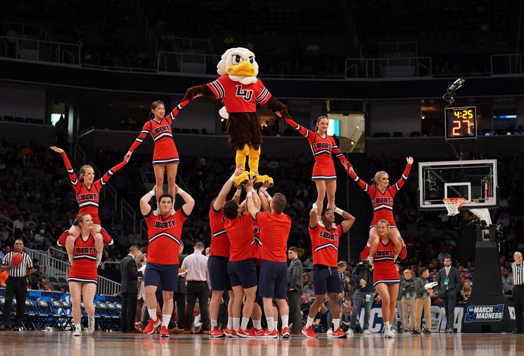Mar 24, 2019; San Jose, CA, USA; Liberty Flames cheerleaders and mascot performs against the Virginia Tech Hokies during the first half in the second round of the 2019 NCAA Tournament at SAP Center. Mandatory Credit: Kyle Terada-Imagn Images