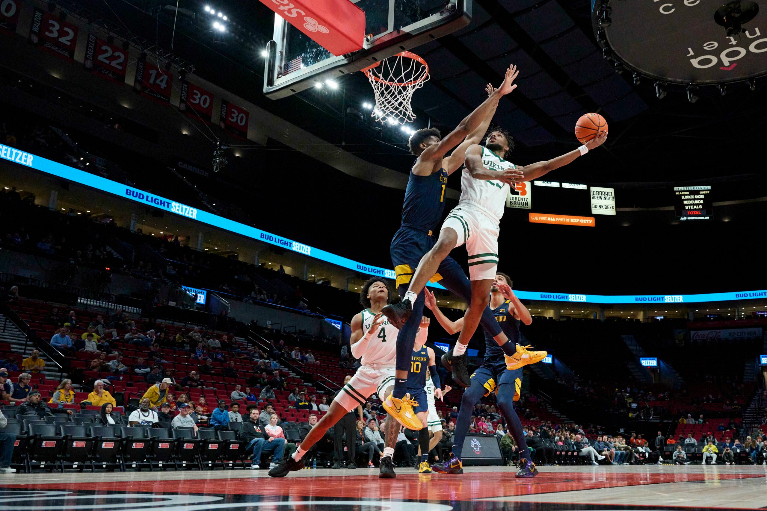 Nov 25, 2022; Portland, Oregon, USA; Portland State Vikings guard Jorell Saterfield (23) shoot a basket against West Virginia Mountaineers forward Mohamed Wague (11) during the first half at Moda Center. Mandatory Credit: Troy Wayrynen-Imagn Images
