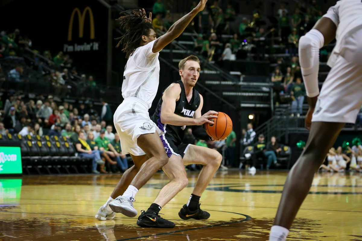Oregon guard Tyrone Williams blocks as Portland s Moses Wood drives toward the basket as the Oregon Ducks host the Portland Pilots Saturday, Dec. 17, 2022, at Matthew Knight Arena in Eugene, Ore.
Ncaa Basketball Oregon Ducks Vs Portland Pilots Men S Basketball Portland Pilots At Oregon Ducks