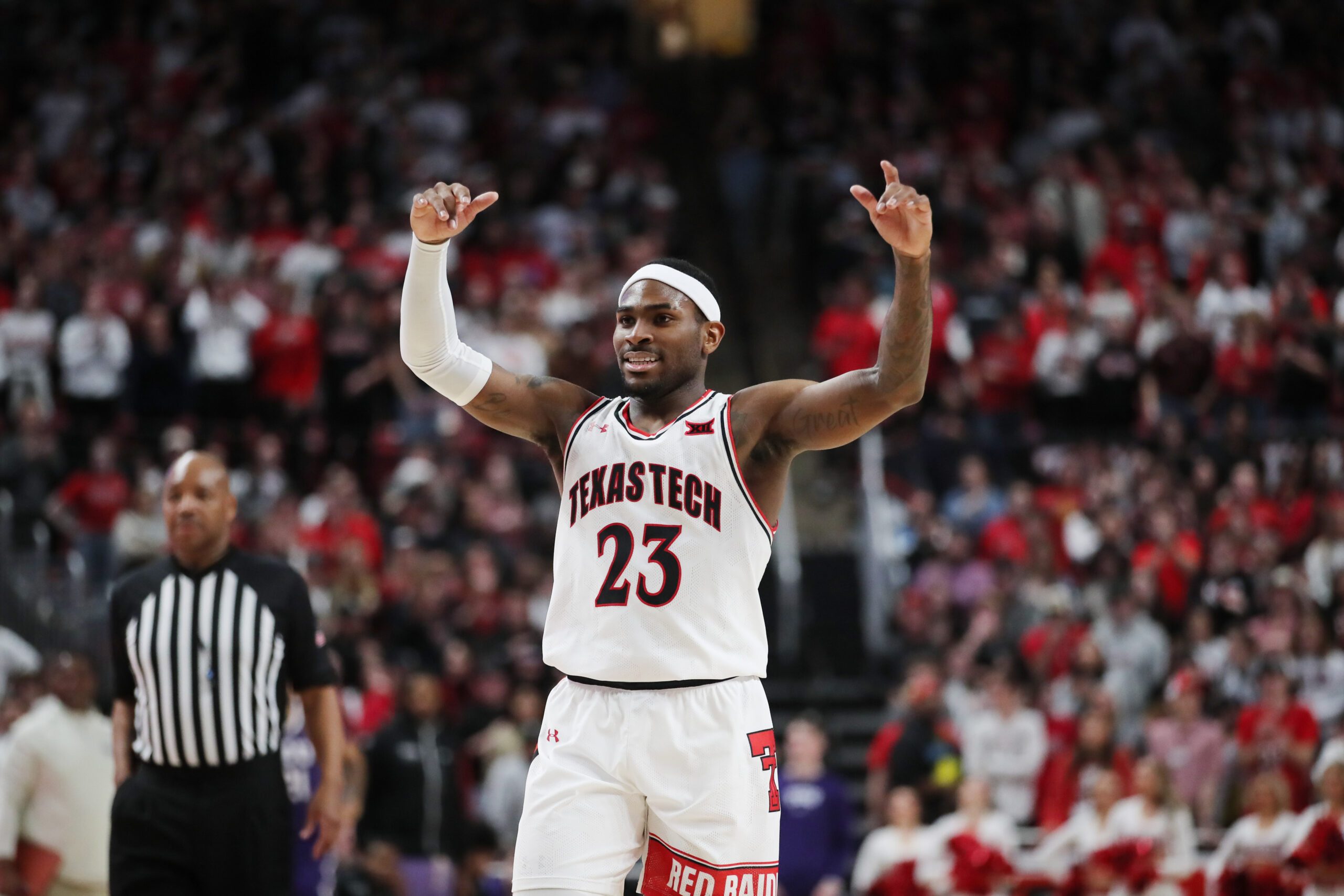 Feb 25, 2023; Lubbock, Texas, USA; Texas Tech Red Raiders guard De   Vion Harmon (23) reacts in the second half in the game against the TCU Horned Frogs at United Supermarkets Arena. Mandatory Credit: Michael C. Johnson-Imagn Images