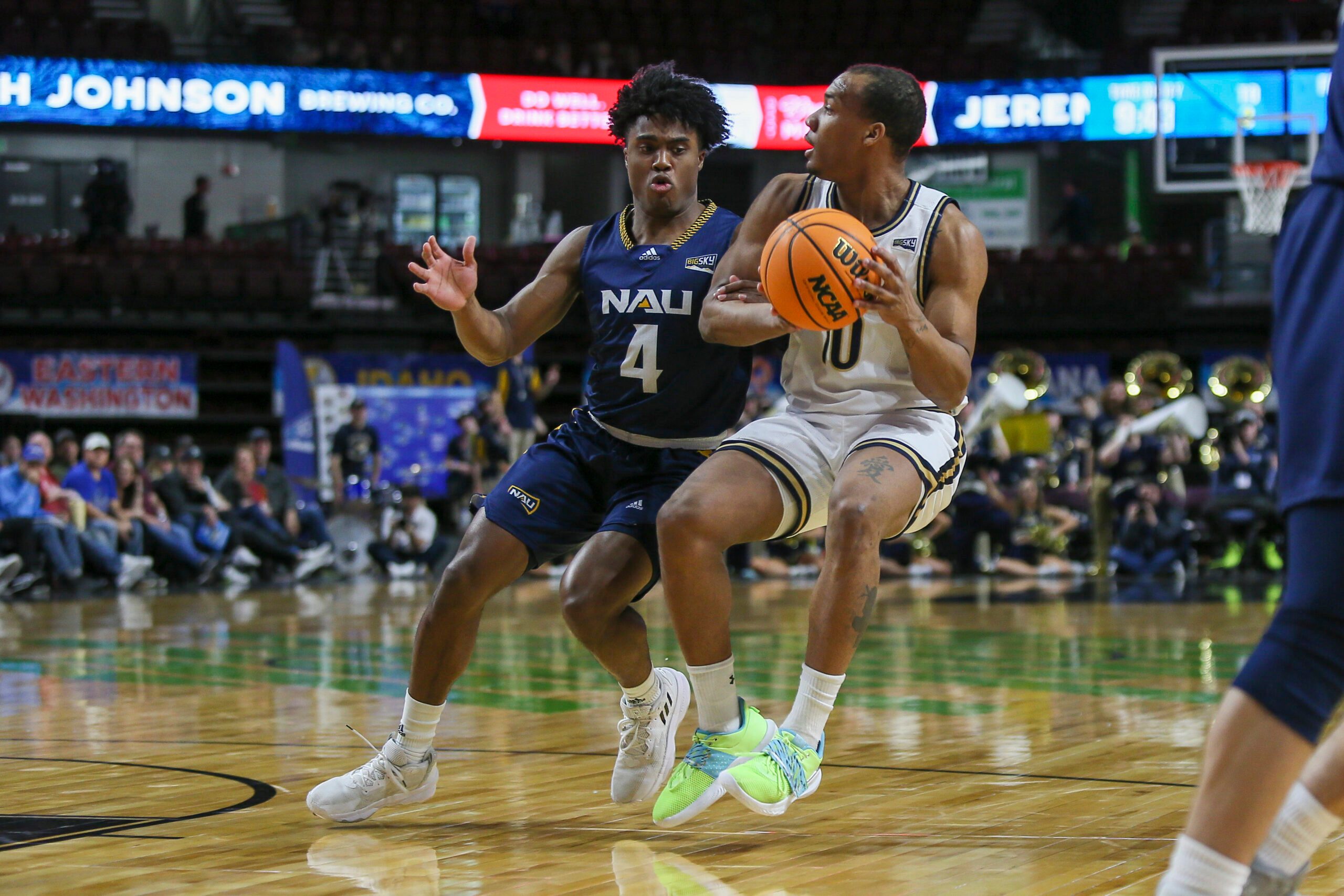 Mar 8, 2023; Boise, ID, USA; Northern Arizona Lumberjacks guard Oakland Fort (4) guards Montana State Bobcats guard Darius Brown II (10) during the first half at Idaho Central Arena. Mandatory Credit: Brian Losness-Imagn Images