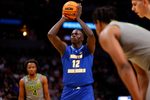 Mar 17, 2023; Denver, CO, USA;  UC Santa Barbara Gauchos forward Evans Kipruto (12) takes a shot at the basket during the first half against Baylor Bears in the first round of the 2023 NCAA men   s basketball tournament at Ball Arena. Mandatory Credit: Michael Ciaglo-Imagn Images