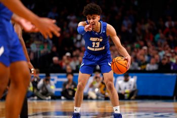 Mar 17, 2023; Denver, CO, USA;  UC Santa Barbara Gauchos guard Ajay Mitchell (13) signals to teammates during the first half against Baylor Bears in the first round of the 2023 NCAA men   s basketball tournament at Ball Arena. Mandatory Credit: Michael Ciaglo-Imagn Images