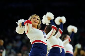 Apr 1, 2023; Houston, TX, USA; Connecticut Huskies cheerleaders perform against the Miami Hurricanes in the semifinals of the Final Four of the 2023 NCAA Tournament at NRG Stadium. Mandatory Credit: Robert Deutsch-Imagn Images