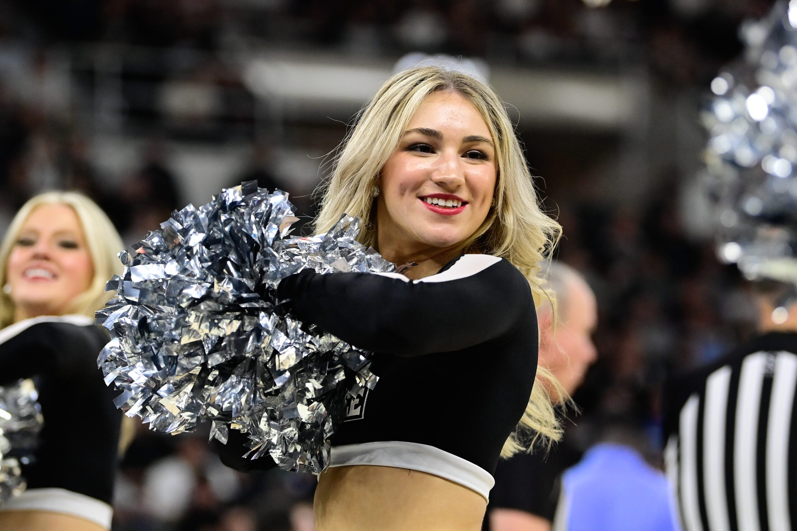 Dec 2, 2023; Providence, Rhode Island, USA; A Providence Friars cheerleader performs during the second half against the Rhode Island Rams at Amica Mutual Pavilion. Mandatory Credit: Eric Canha-Imagn Images