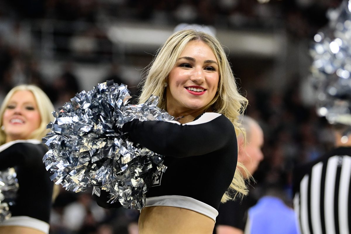 Dec 2, 2023; Providence, Rhode Island, USA; A Providence Friars cheerleader performs during the second half against the Rhode Island Rams at Amica Mutual Pavilion. Mandatory Credit: Eric Canha-Imagn Images