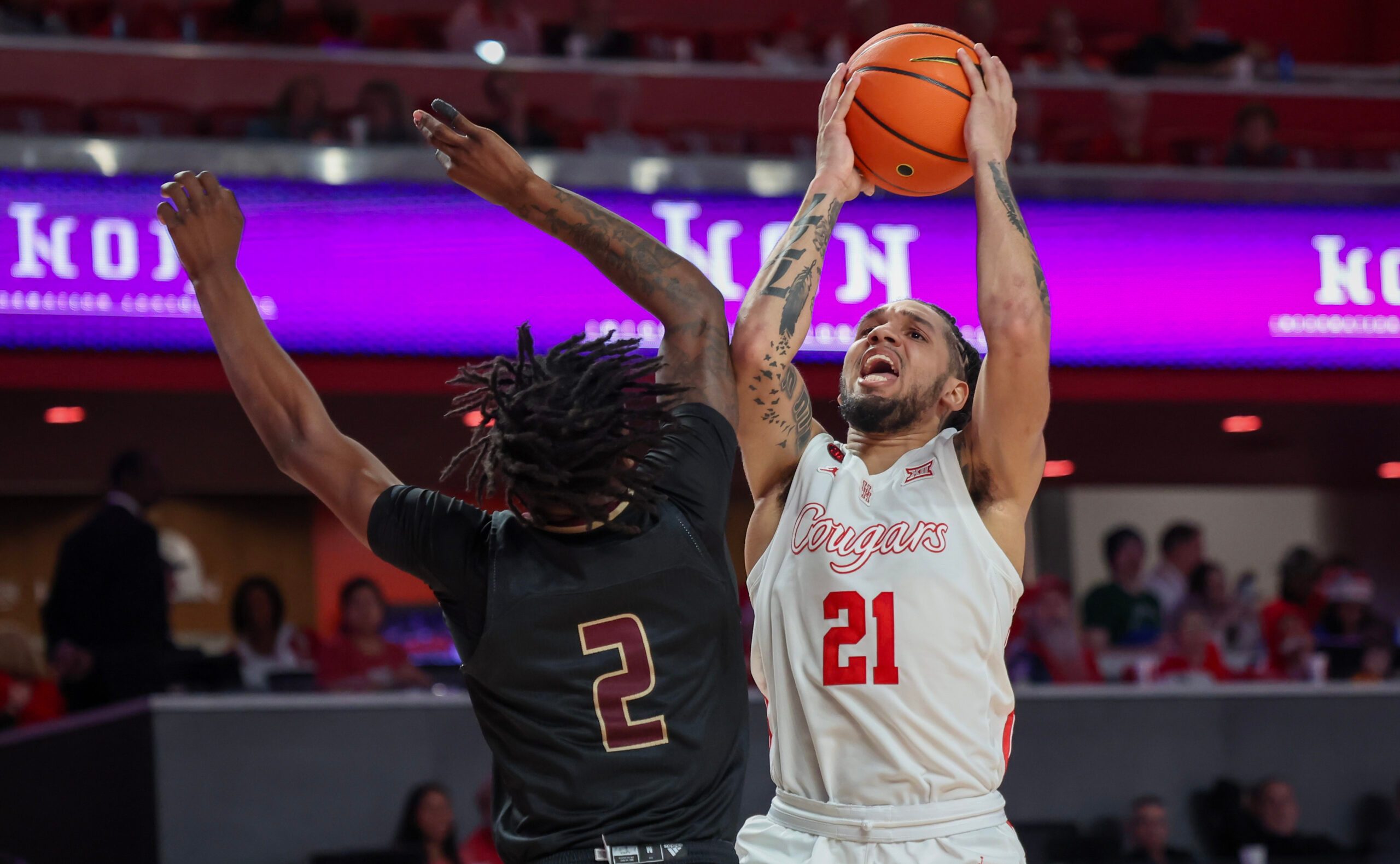 Dec 21, 2023; Houston, Texas, USA; Houston Cougars guard Emanuel Sharp (21) drives to the basket against Texas State Bobcats guard Dontae Horne (2) in the second half at Fertitta Center. Mandatory Credit: Thomas Shea-Imagn Images