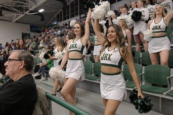 Jacksonville Dolphins cheerleaders in the stands during Friday night's game. Jacksonville University Dolphins hosted the University of North Florida Ospreys in Men's basketball in the historic Swisher Gym Friday night, February 23, 2024. The Ospreys led 25 to 23 at the half.