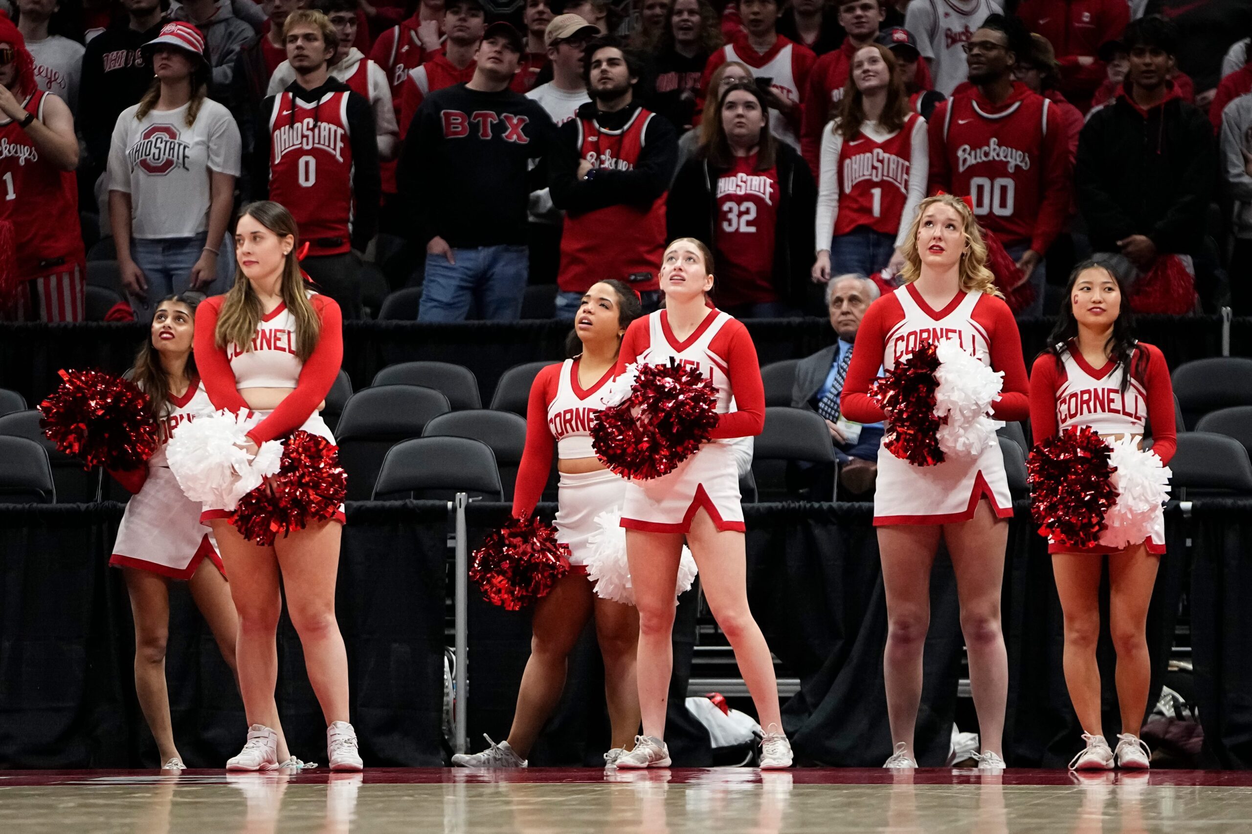 Mar 19, 2024; Columbus, OH, USA; Cornell Big Red cheerleaders react during the second half of the NIT basketball game against the Ohio State Buckeyes at Value City Arena. Ohio State won 88-83.
