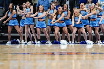 The Indiana State Sycamores cheerleaders dance along the sidelines Wednesday, March 20, 2024, during the first round of the NIT at the Hulman Center in Terre Haute.