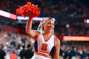 Sep 20, 2024; Syracuse, New York, USA; A Syracuse Orange cheerleader performs prior to a game against the Stanford Cardinal at the JMA Wireless Dome. Mandatory Credit: Rich Barnes-Imagn Images