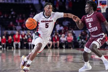 Nov 10, 2024; Athens, Georgia, USA; Georgia Bulldogs guard Silas Demary Jr. (5) dribbles against Texas Southern Tigers guard Kavion McClain (2) at Stegeman Coliseum. Mandatory Credit: Dale Zanine-Imagn Images