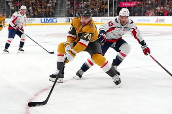 Nov 17, 2024; Las Vegas, Nevada, USA; Vegas Golden Knights left wing Tanner Pearson (70) controls the puck in front of Washington Capitals right wing Tom Wilson (43) during the second period at T-Mobile Arena. Mandatory Credit: Stephen R. Sylvanie-Imagn Images