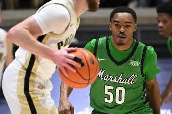Nov 23, 2024; West Lafayette, Indiana, USA; Marshall Thundering Herd guard Jalen Speer (50) looks at a ball controlled by Purdue Boilermakers guard Braden Smith (3) during the first half at Mackey Arena. Mandatory Credit: Marc Lebryk-Imagn Images