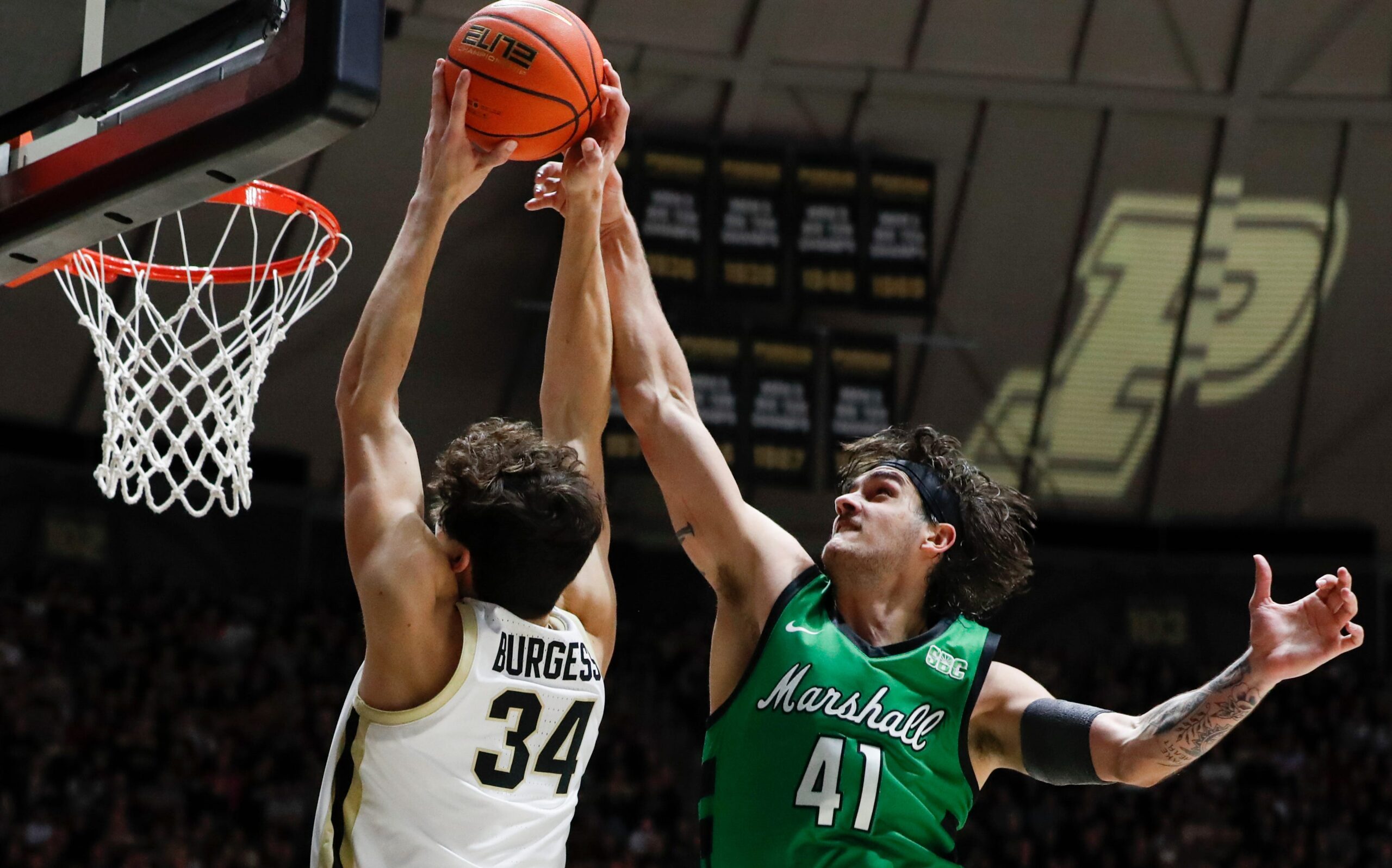 Marshall Thundering Herd forward Nate Martin (41) fouls Purdue Boilermakers forward Raleigh Burgess (34) Saturday, Nov. 23, 2024, during the NCAA men’s basketball game at Mackey Arena in West Lafayette, Ind. Purdue Boilermakers won 80-45.
