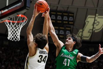 Marshall Thundering Herd forward Nate Martin (41) fouls Purdue Boilermakers forward Raleigh Burgess (34) Saturday, Nov. 23, 2024, during the NCAA men’s basketball game at Mackey Arena in West Lafayette, Ind. Purdue Boilermakers won 80-45.