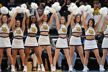 Nov 30, 2024; Milwaukee, Wisconsin, USA;  Marquette Golden Eagles cheerleaders perform in the first half against the Western Carolina Catamounts at Fiserv Forum. Mandatory Credit: Benny Sieu-Imagn Images
