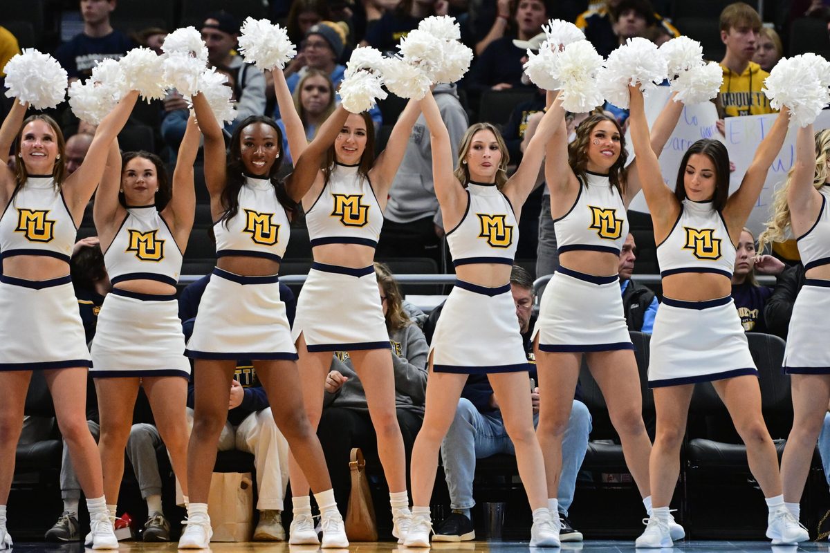 Nov 30, 2024; Milwaukee, Wisconsin, USA; Marquette Golden Eagles cheerleaders perform in the first half against the Western Carolina Catamounts at Fiserv Forum. Mandatory Credit: Benny Sieu-Imagn Images
