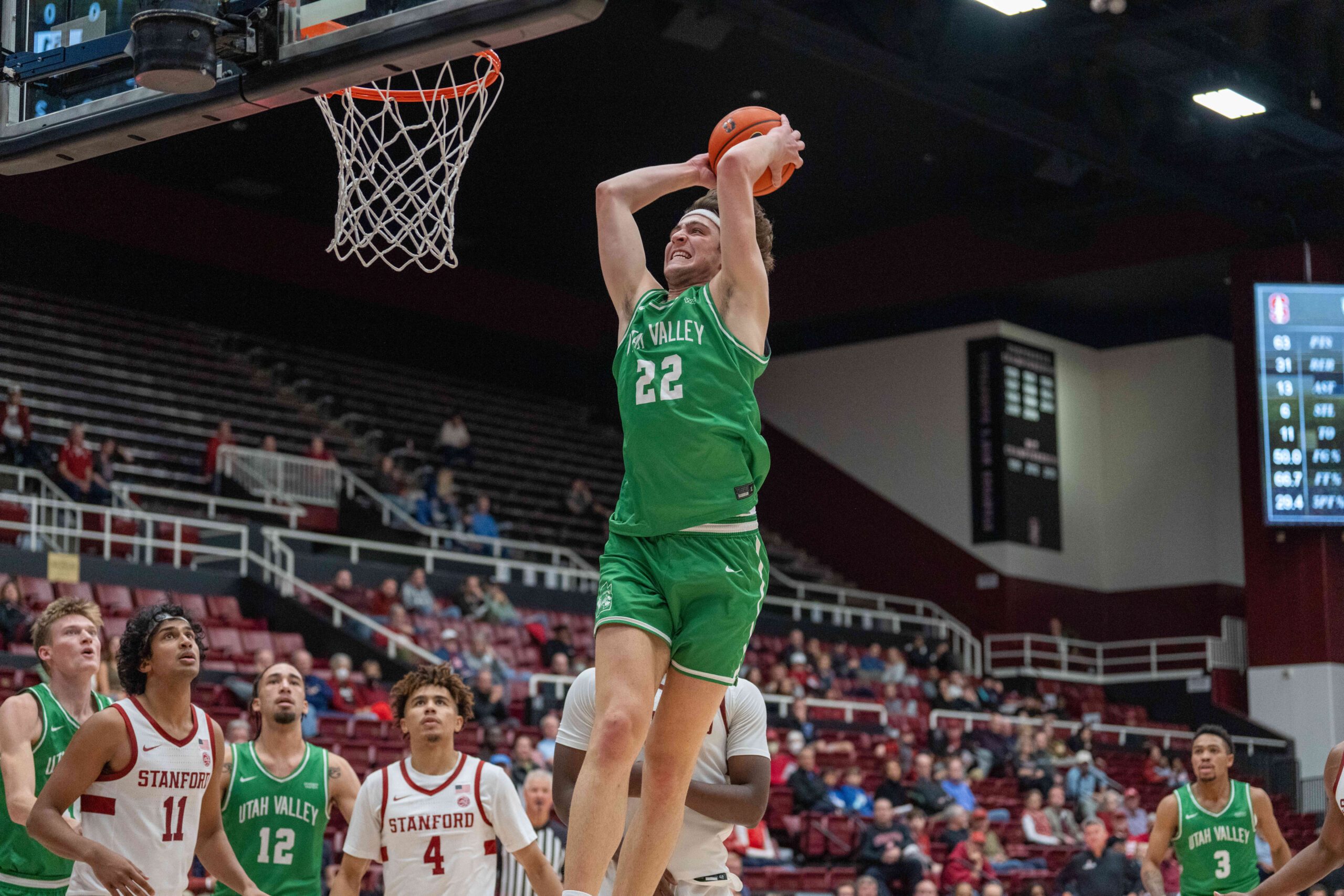 Dec 3, 2024; Stanford, California, USA; Utah Valley Wolverines forward Carter Welling (22) dunks the basketball against the Stanford Cardinal during the second half at Maples Pavilion. Mandatory Credit: Neville E. Guard-Imagn Images