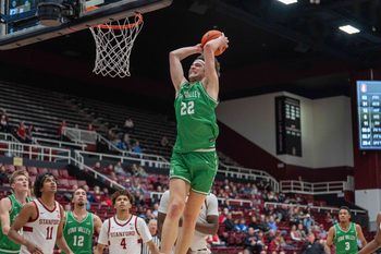Dec 3, 2024; Stanford, California, USA; Utah Valley Wolverines forward Carter Welling (22) dunks the basketball against the Stanford Cardinal during the second half at Maples Pavilion. Mandatory Credit: Neville E. Guard-Imagn Images