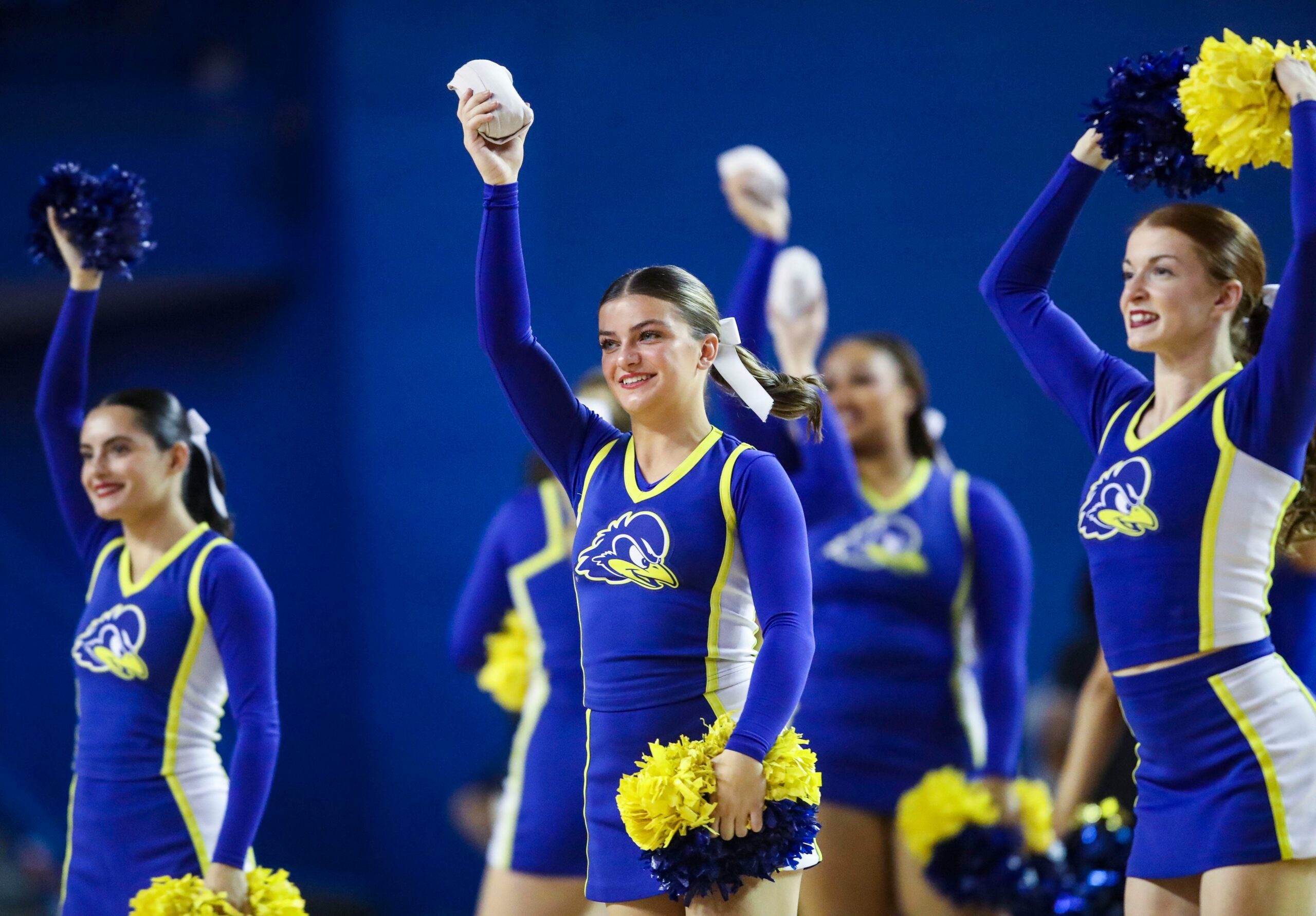 Delaware cheerleaders work in a timeout in the second half of the Blue Hens' 93-80 win against Delaware State at the Bob Carpenter Center, Tuesday, Dec. 3, 2024.