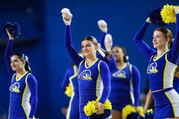 Delaware cheerleaders work in a timeout in the second half of the Blue Hens' 93-80 win against Delaware State at the Bob Carpenter Center, Tuesday, Dec. 3, 2024.