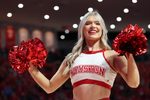 Dec 10, 2024; Houston, Texas, USA;  A Houston Cougars cheerleader perform during a Troy Trojans timeout in the first half at Fertitta Center. Mandatory Credit: Thomas Shea-Imagn Images