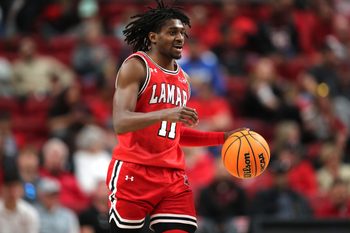 Dec 21, 2024; Lubbock, Texas, USA; Lamar Cardinals guard Ja”Sean Jackson (11) brings the ball up court against the Texas Tech Red Raiders in the second half at United Supermarkets Arena. Mandatory Credit: Michael C. Johnson-Imagn Images