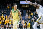 Jan 14, 2025; Wichita, Kansas, USA; Charlotte 49ers forward Giancarlo Rosado (1) brings the ball up court during the first half against the Wichita State Shockers at Charles Koch Arena. Mandatory Credit: William Purnell-Imagn Images