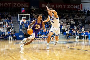 Northern Iowa's Tytan Anderson (32) drives past Drake's Daniel Abreu (54) on Wednesday, Jan. 29, 2025, at the Knapp Center.