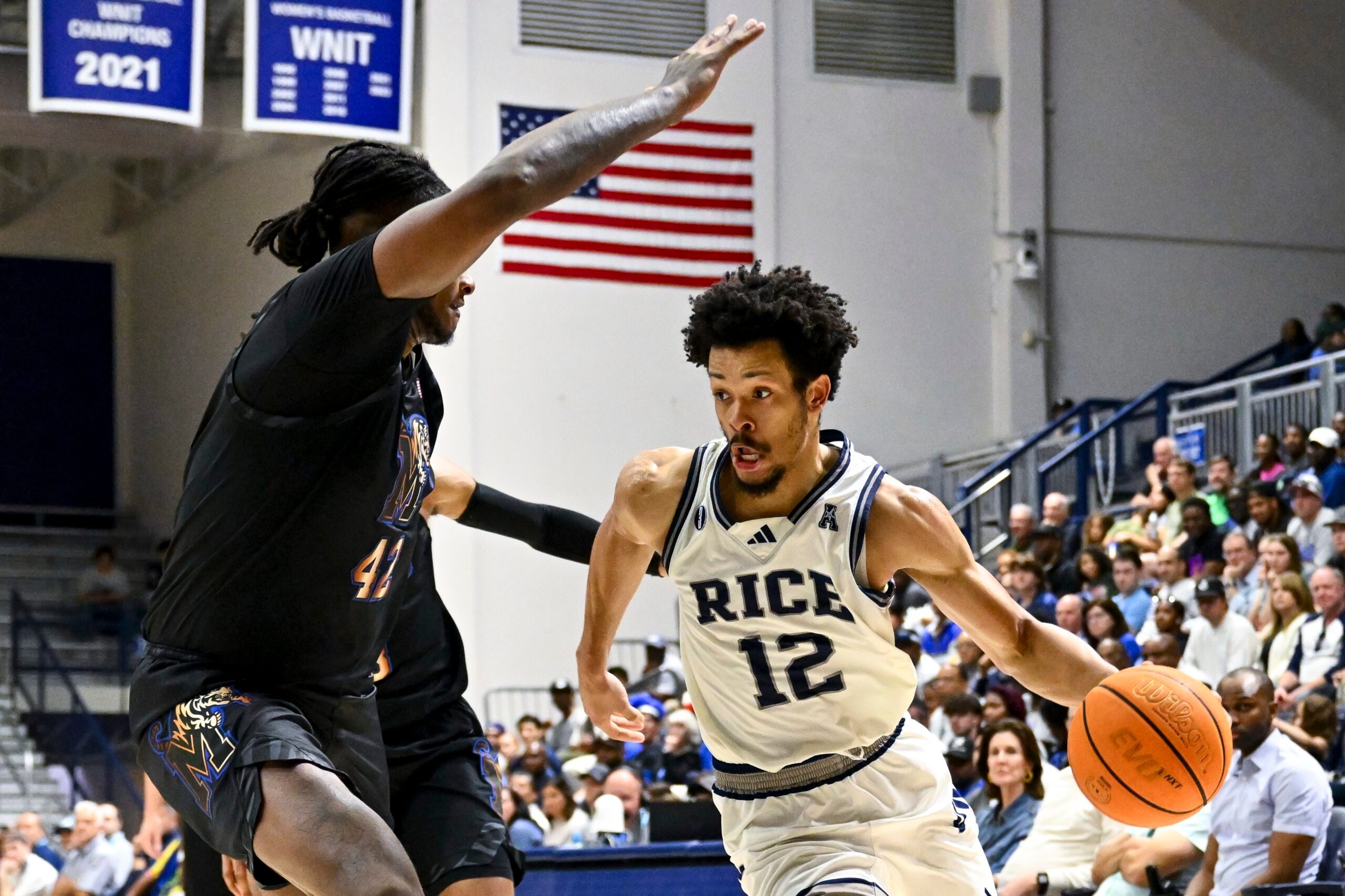 Feb 2, 2025; Houston, Texas, USA; Rice Owls guard Trae Broadnax (12) drives to the basket during the second half against the Memphis Tigers at Tudor Fieldhouse. Mandatory Credit: Maria Lysaker-Imagn Images
