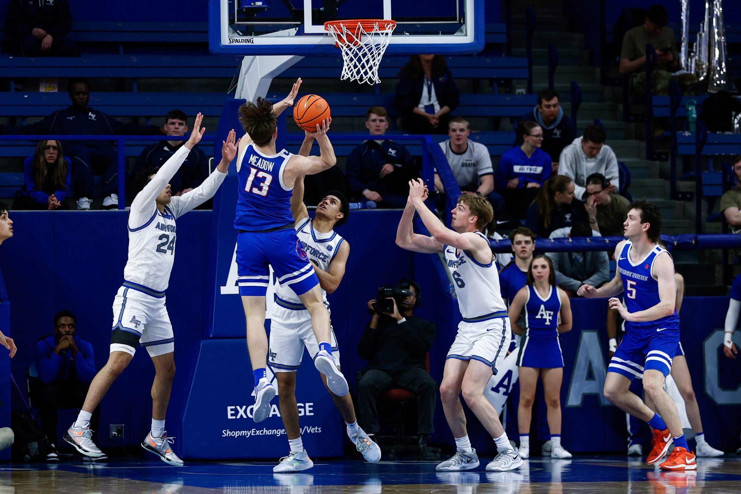 Mar 4, 2025; Colorado Springs, Colorado, USA; Boise State Broncos forward Andrew Meadow (13) drives to the net against Air Force Falcons guard Jeffrey Mills (24) and guard Yoda Oke (20) and forward Will Cooper (6) in the second half at Clune Arena. Mandatory Credit: Isaiah J. Downing-Imagn Images