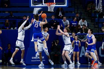 Mar 4, 2025; Colorado Springs, Colorado, USA; Boise State Broncos forward Andrew Meadow (13) drives to the net against Air Force Falcons guard Jeffrey Mills (24) and guard Yoda Oke (20) and forward Will Cooper (6) in the second half at Clune Arena. Mandatory Credit: Isaiah J. Downing-Imagn Images