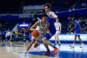 Mar 4, 2025; Colorado Springs, Colorado, USA; Air Force Falcons guard Yoda Oke (20) controls the ball as Boise State Broncos guard RJ Keene II (5) guards in the second half at Clune Arena. Mandatory Credit: Isaiah J. Downing-Imagn Images